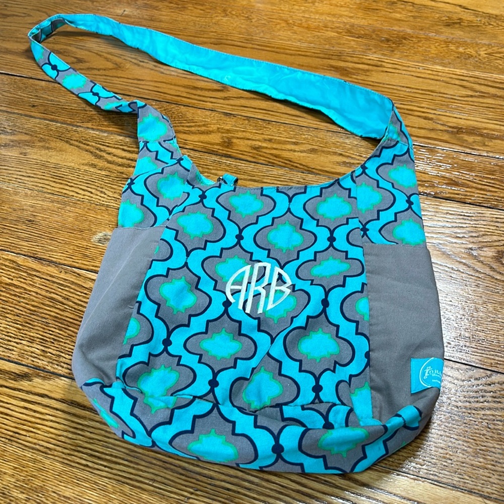 Initials, Inc. brand crossbody tire.  Monogram “ARB”. Aqua and plum/gray.